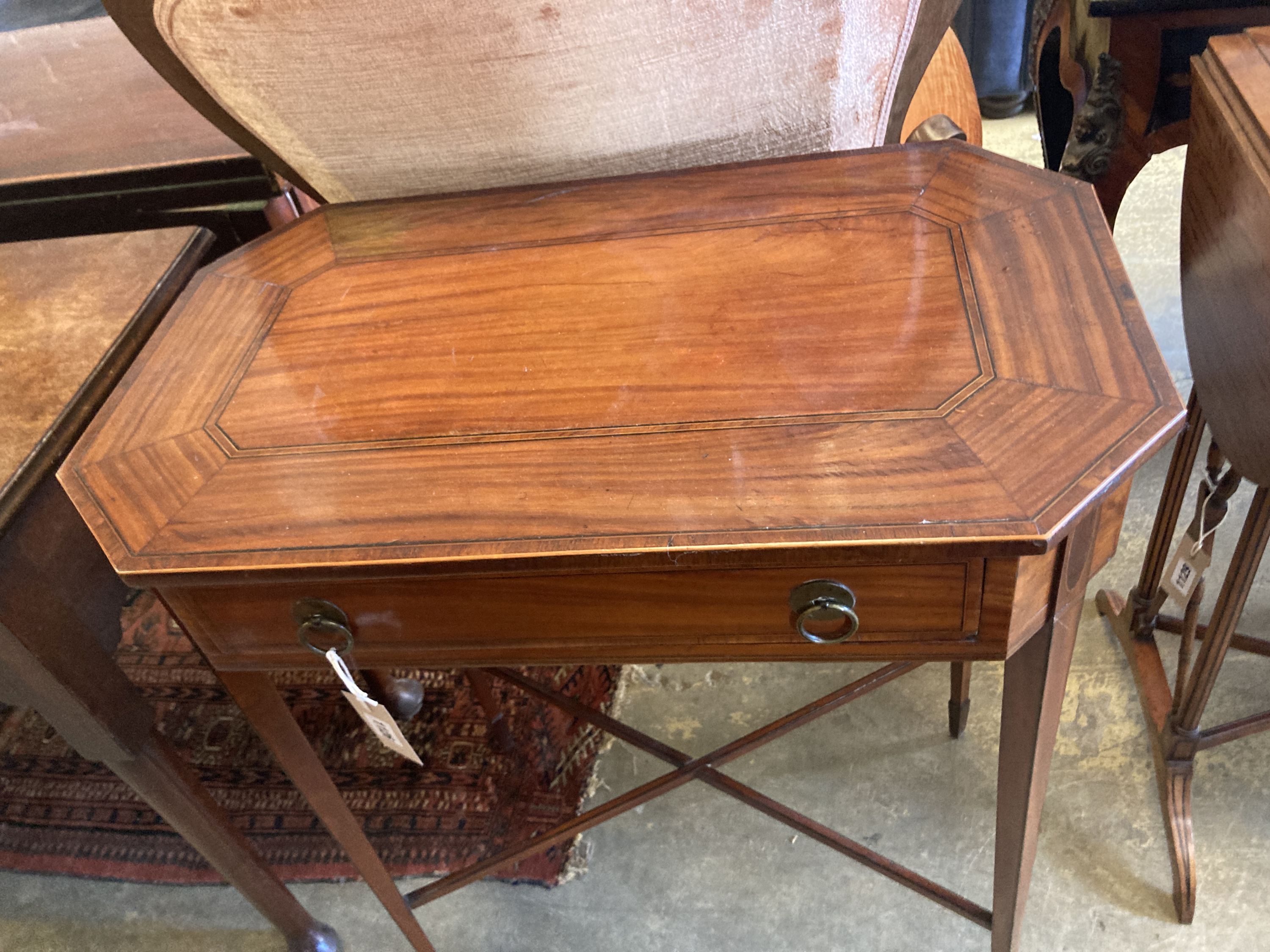 A George III Sheraton style inlaid mahogany side table of canted rectangular form, width 62cm, depth 37cm, height 75cm